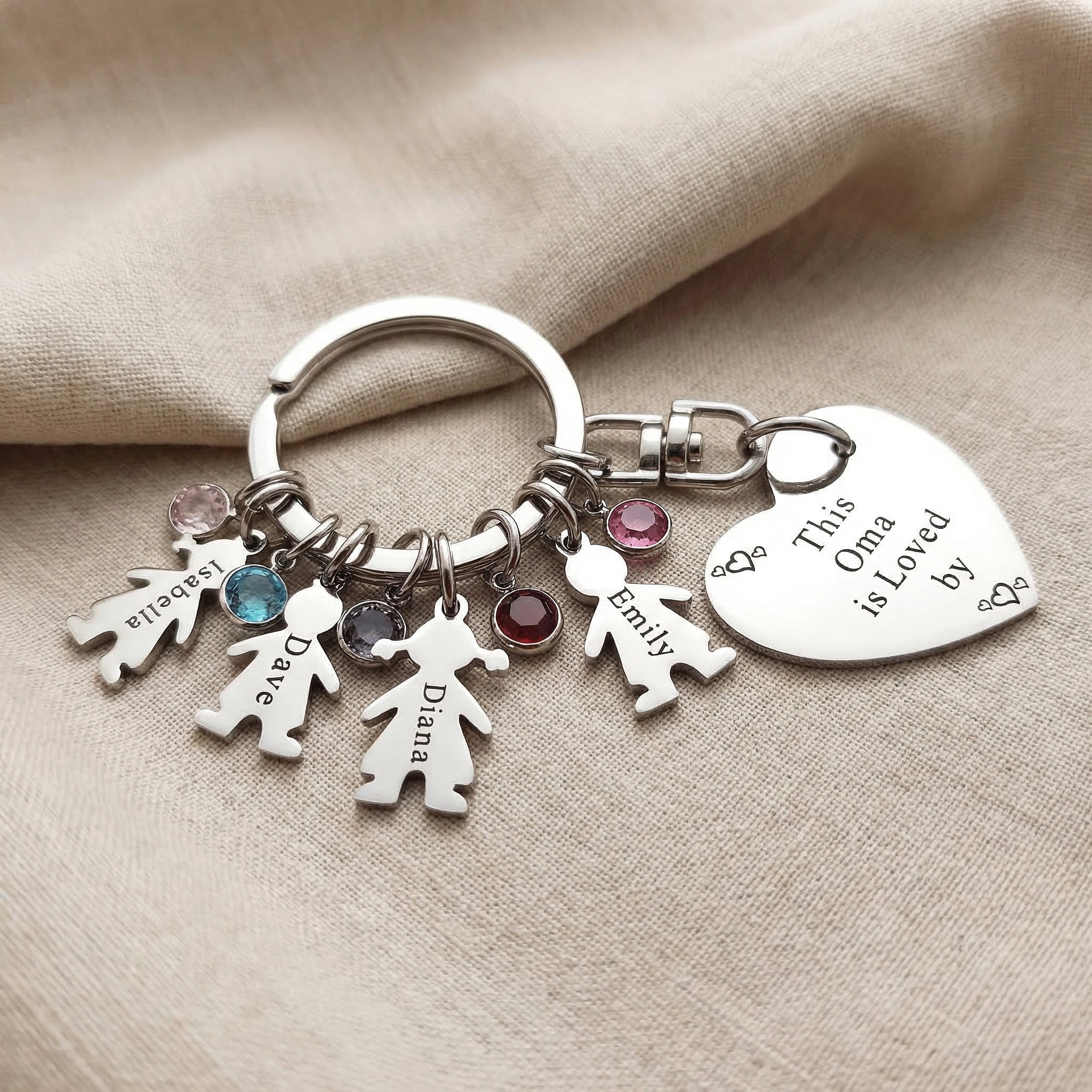 Kids Love Heart Keyring showing multiple charm options with engraved heart disc and child figures