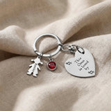 Kids Love Heart Keyring in silver with engraved heart disc and child charm, personalised keepsake