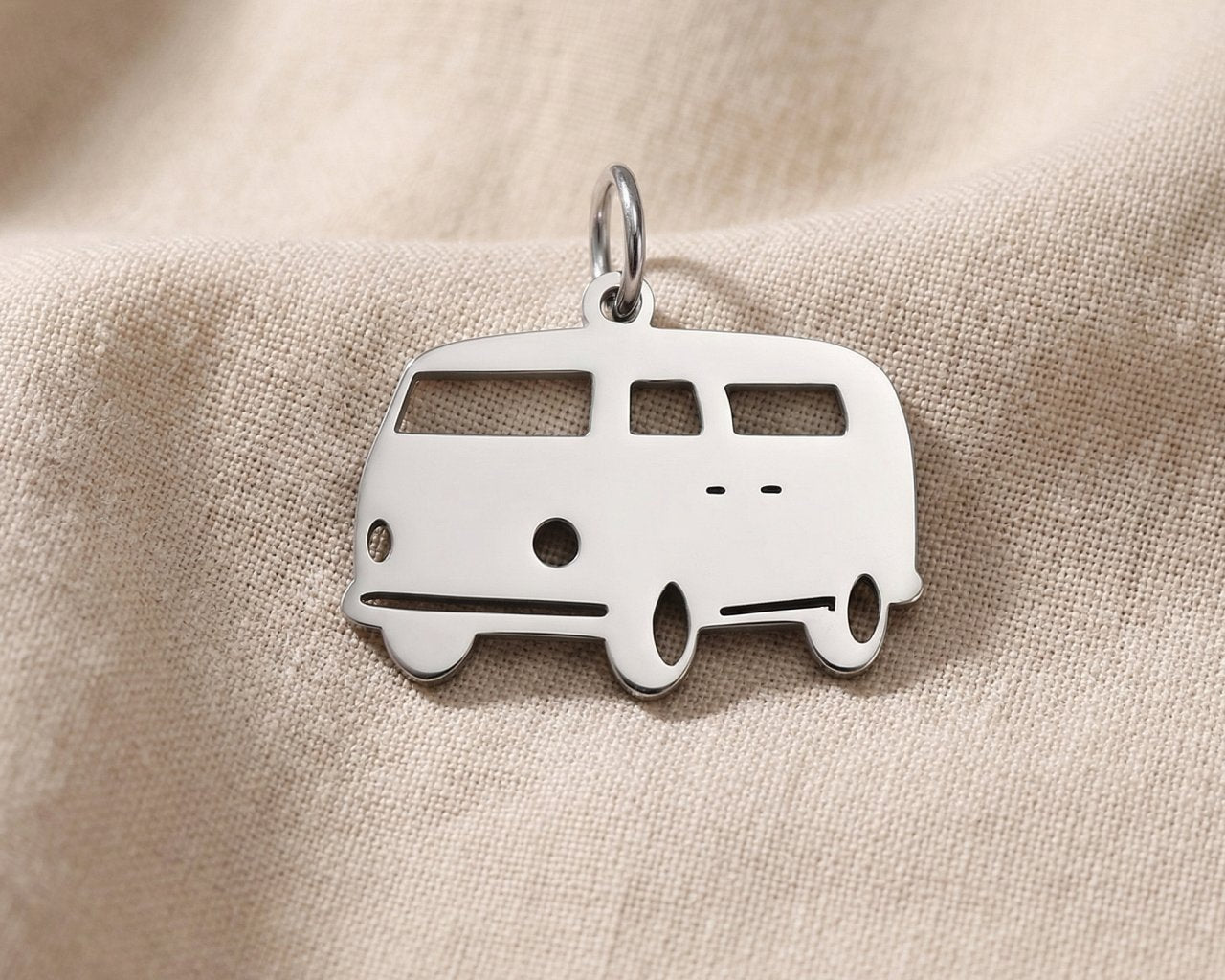 Silver kombi van charm for keyring symbolizing travel adventures, freedom, and road trip memories