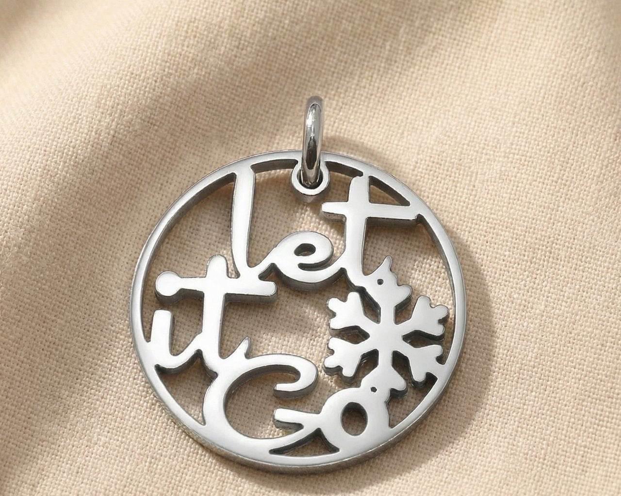 Silver inspirational charm for keyring with decorative cutout design symbolizing freedom, healing, and letting go