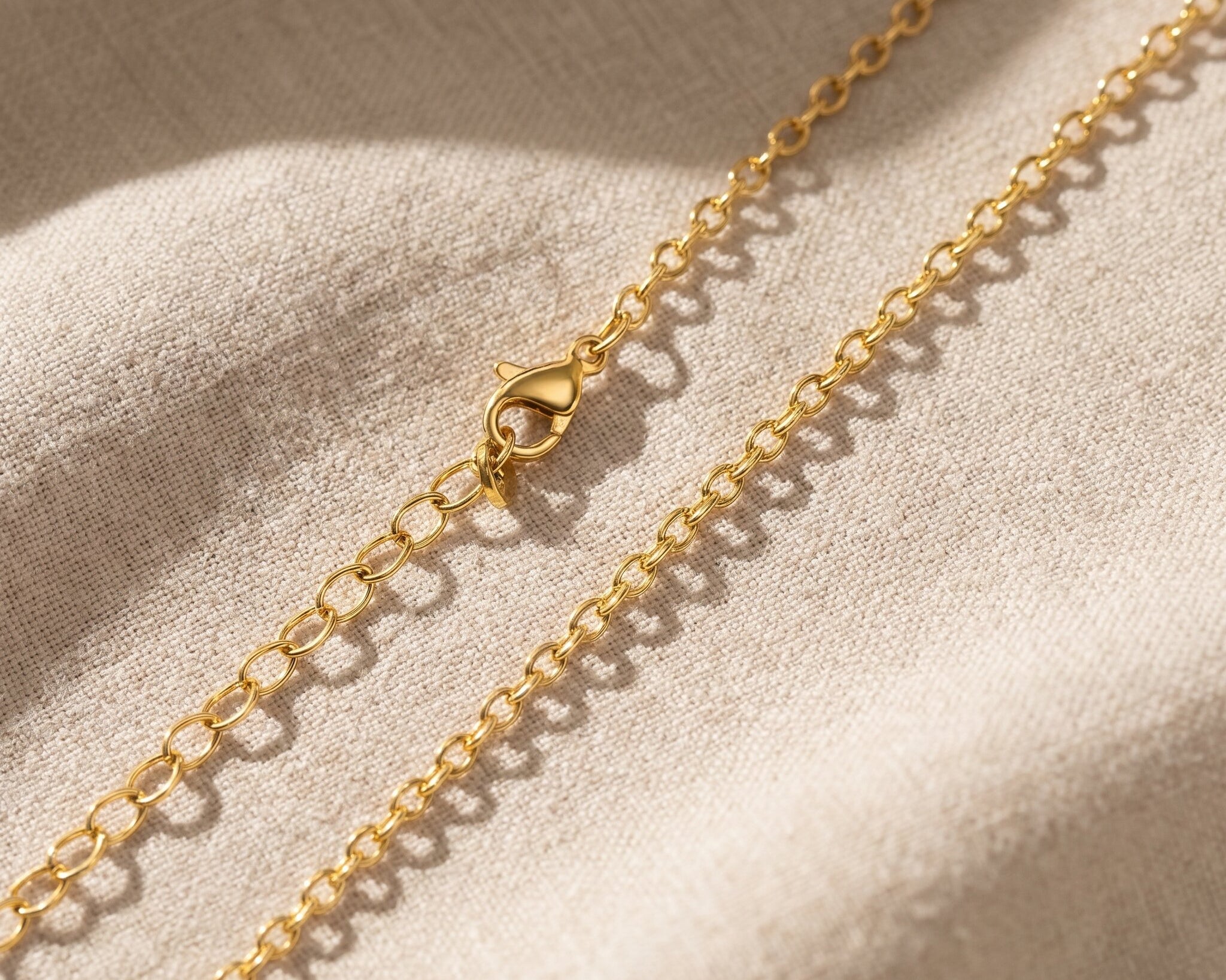 Link chain necklace in gold with polished chain link design, elegant jewellery for layering and everyday wear