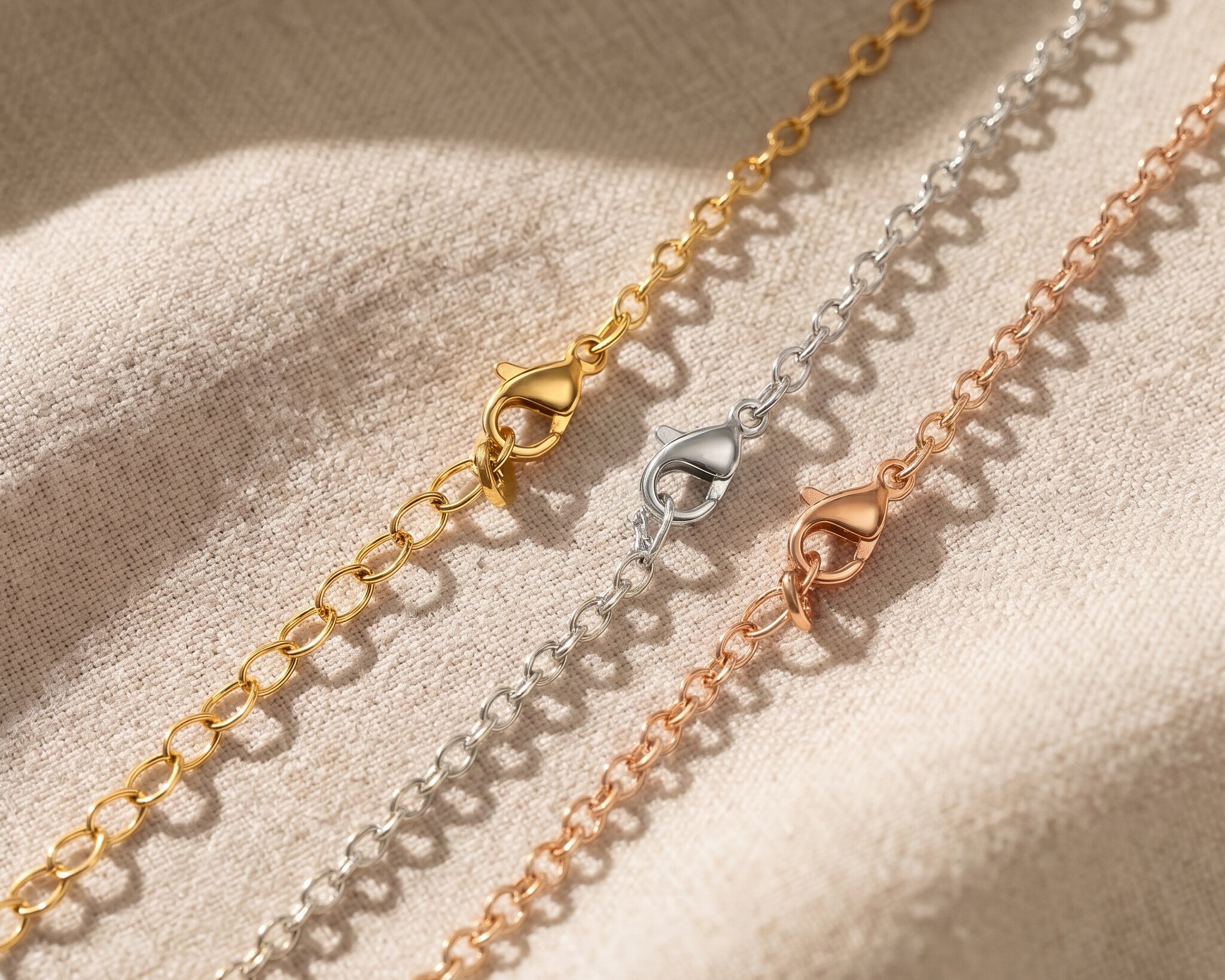 Link chain necklace tone comparison showing gold, silver and rose gold minimalist chain jewellery finishes