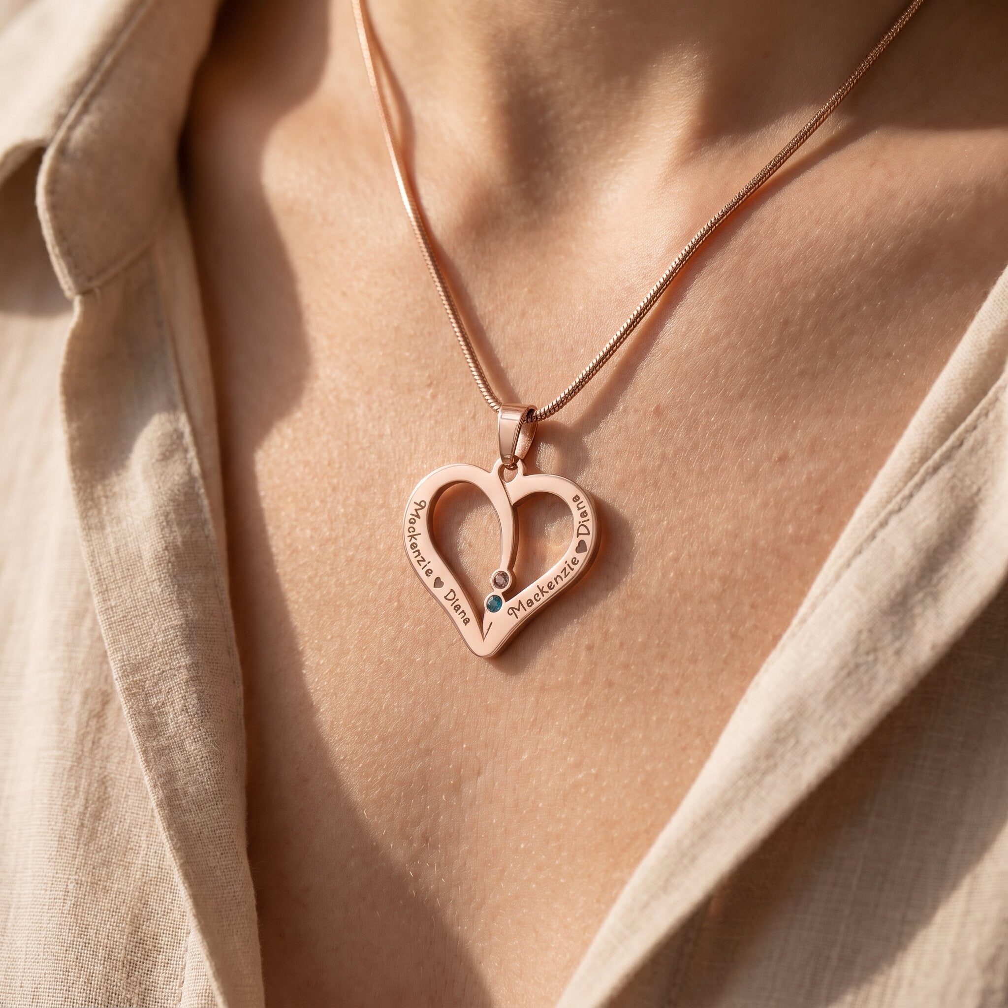 Woman wearing birthstone heart necklace, personalised family jewellery for mum with meaningful design