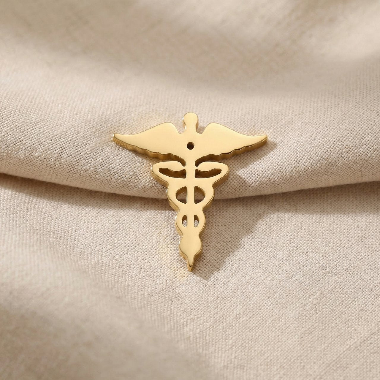 Gold medical symbol charm for Dream Locket bracelet honoring healthcare professionals and medical journeys