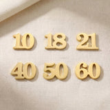Gold milestone number charms for Dream Locket bracelet celebrating birthdays, anniversaries, and special life moments