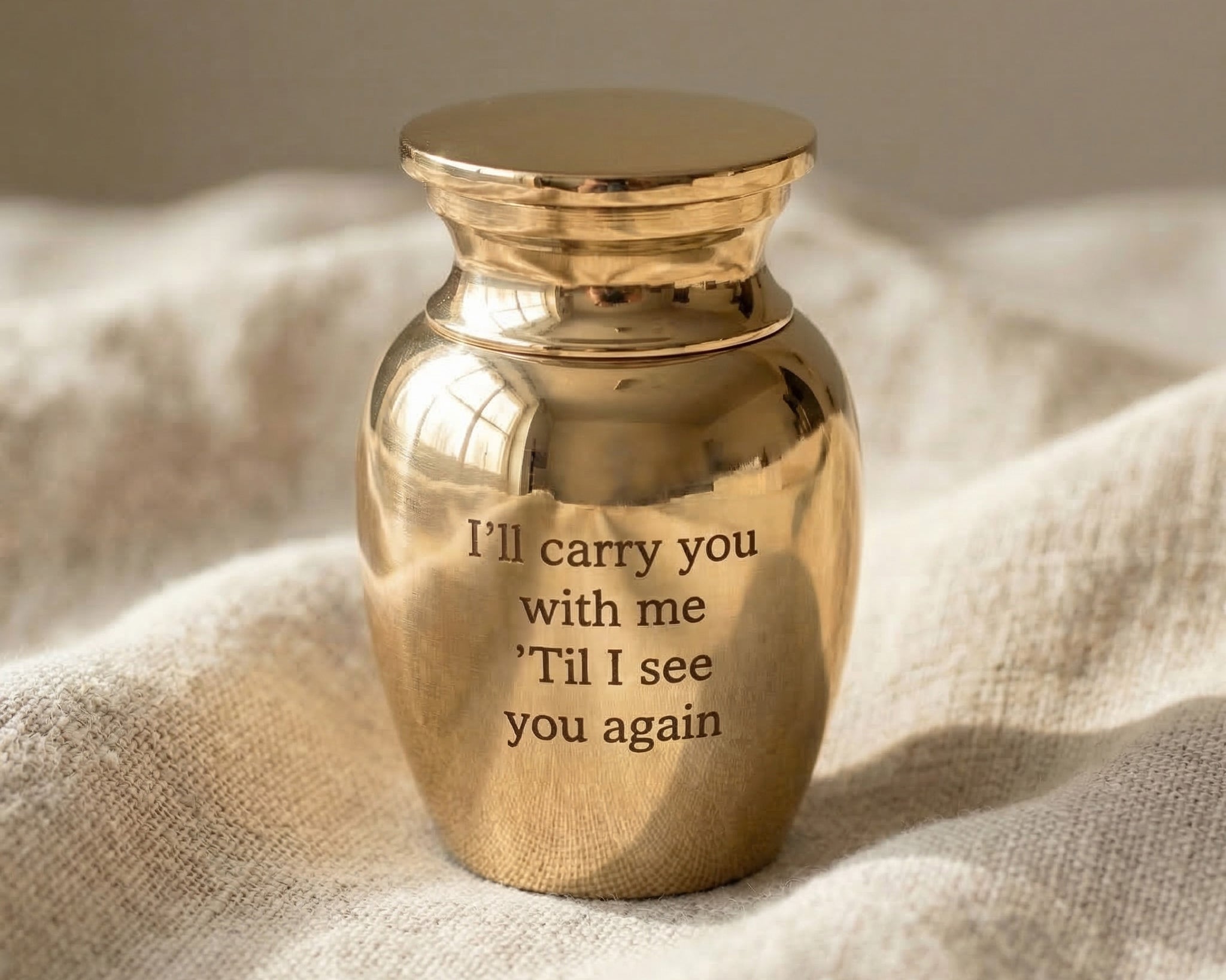 Mini Personalised Keepsake Urn in gold with engraved message, memorial keepsake urn