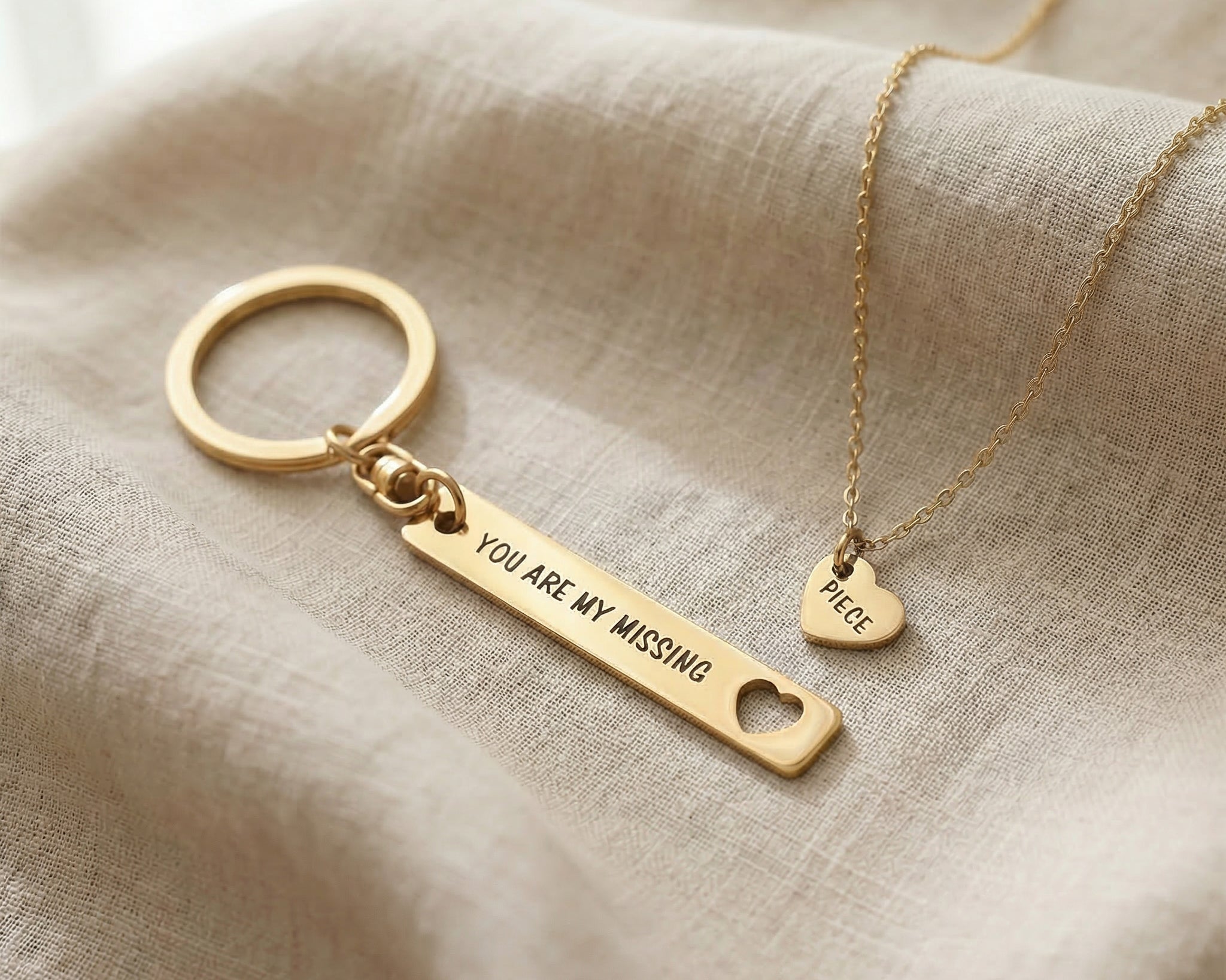 Missing piece set in gold showing matching necklace and keyring design