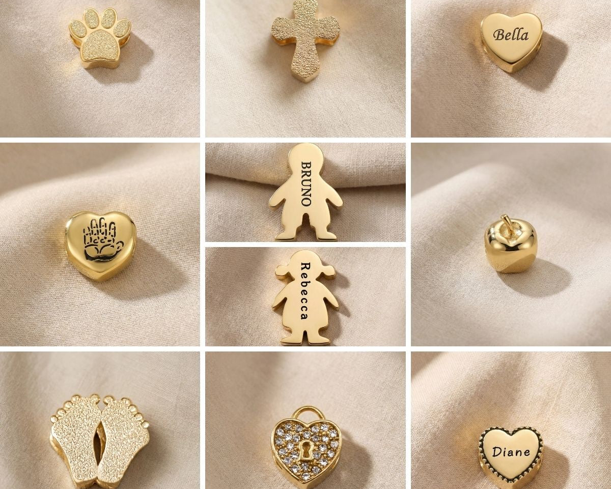 Moments charm bracelet showing selection of personalised charms and decorative inserts