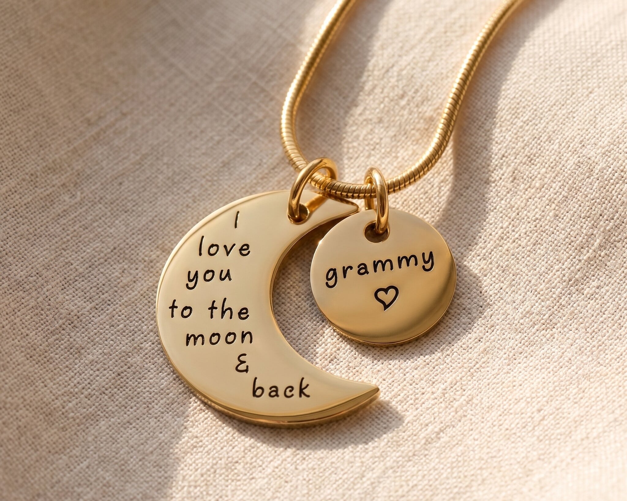 Moon and back necklace in gold with engraved message charms, meaningful family keepsake jewellery gift