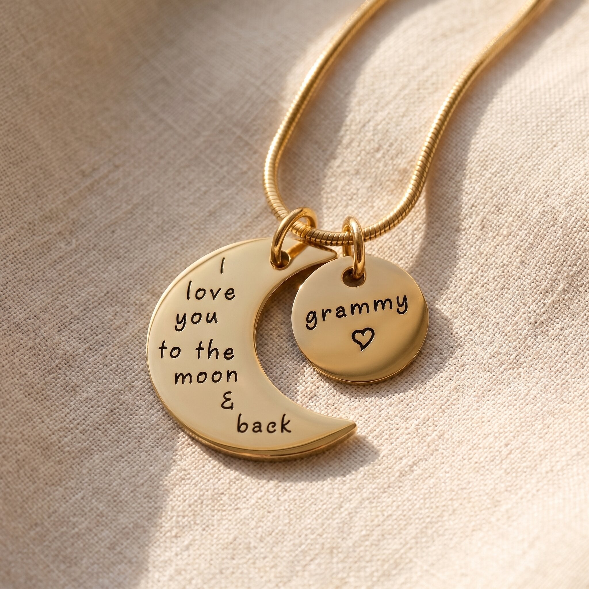 Moon and back necklace in gold with engraved message charms, meaningful family keepsake jewellery gift