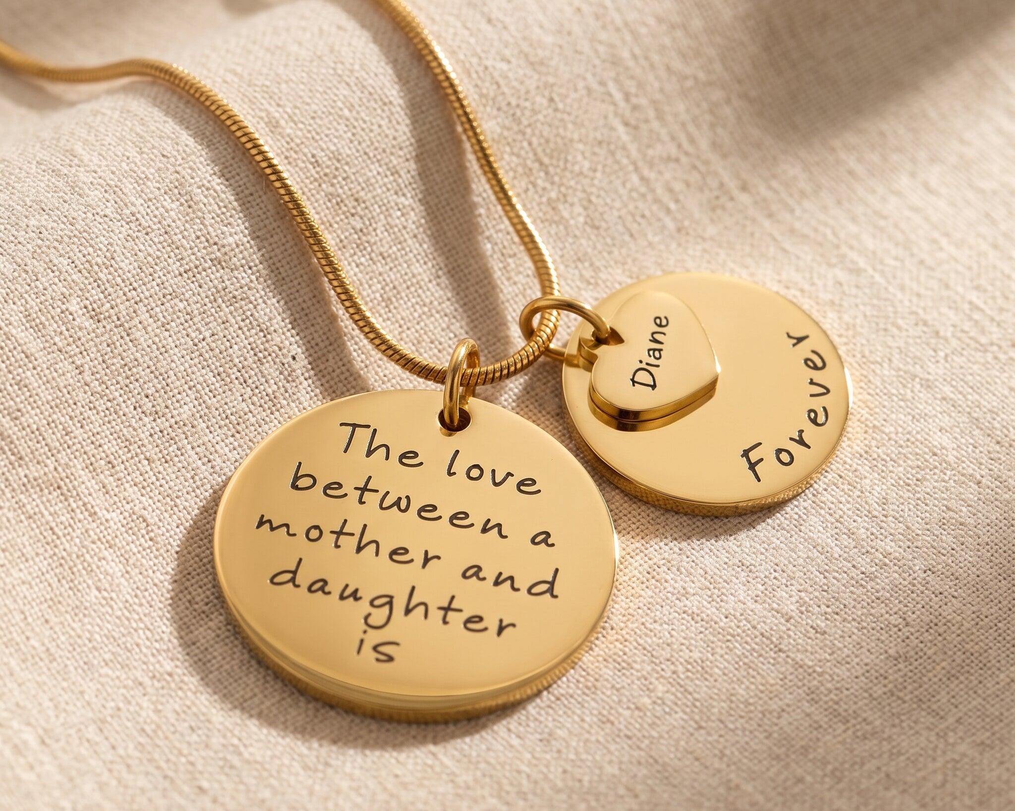 Mother forever necklace in gold with layered pendant design, two engraved discs and heart charm keepsake jewellery