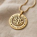 Gold My Family Tree necklace with circular tree of life pendant displayed on neutral background