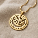 Gold My Family Tree necklace with circular tree of life pendant displayed on neutral background