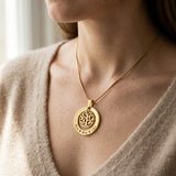 Woman wearing My Family Tree necklace with circular tree of life pendant on delicate chain