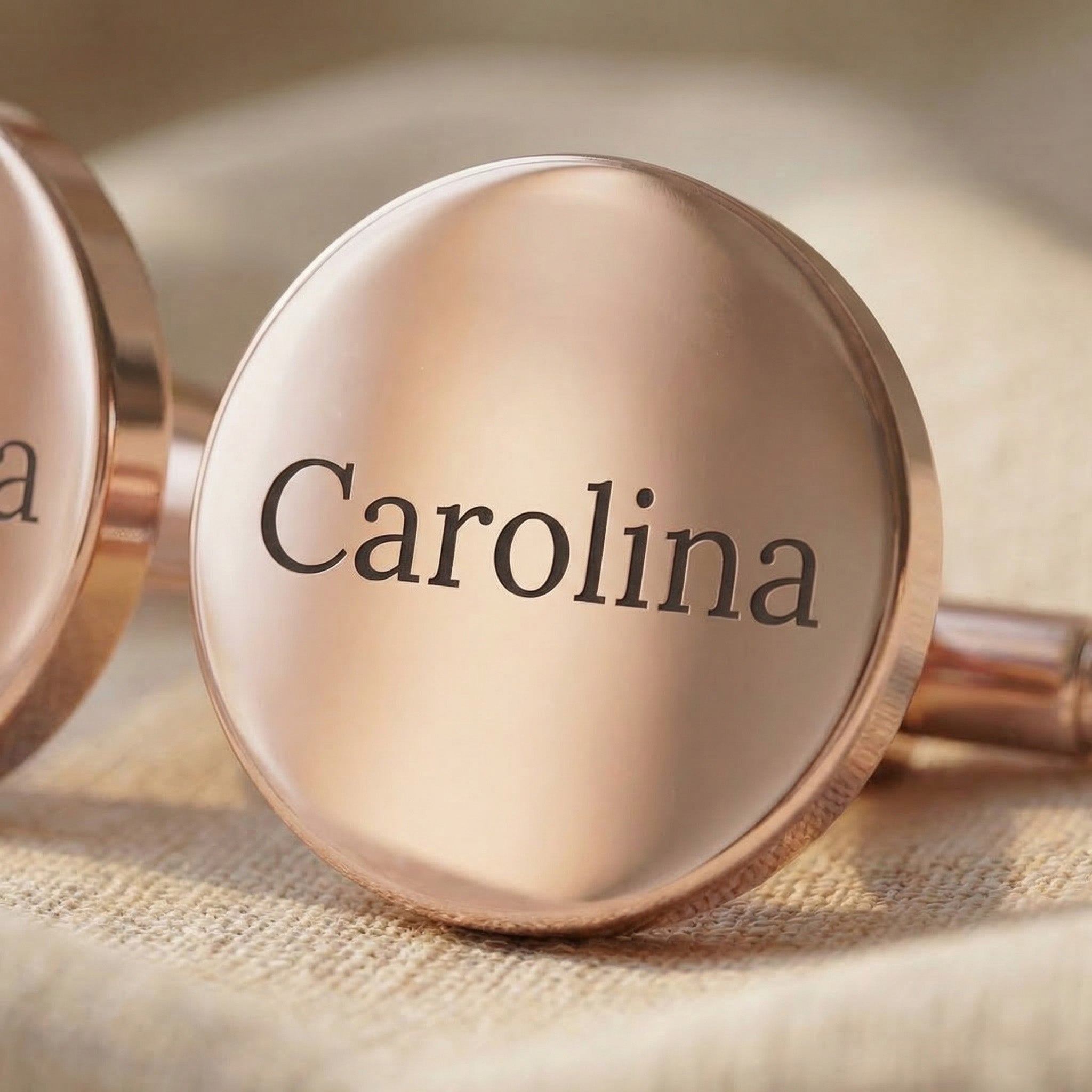 Close-up of Personalised cufflinks with engraved message on round surface