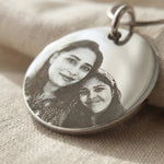 Close-up of Personalised Disc Pendant with custom photo engraving showing fine detail and finish