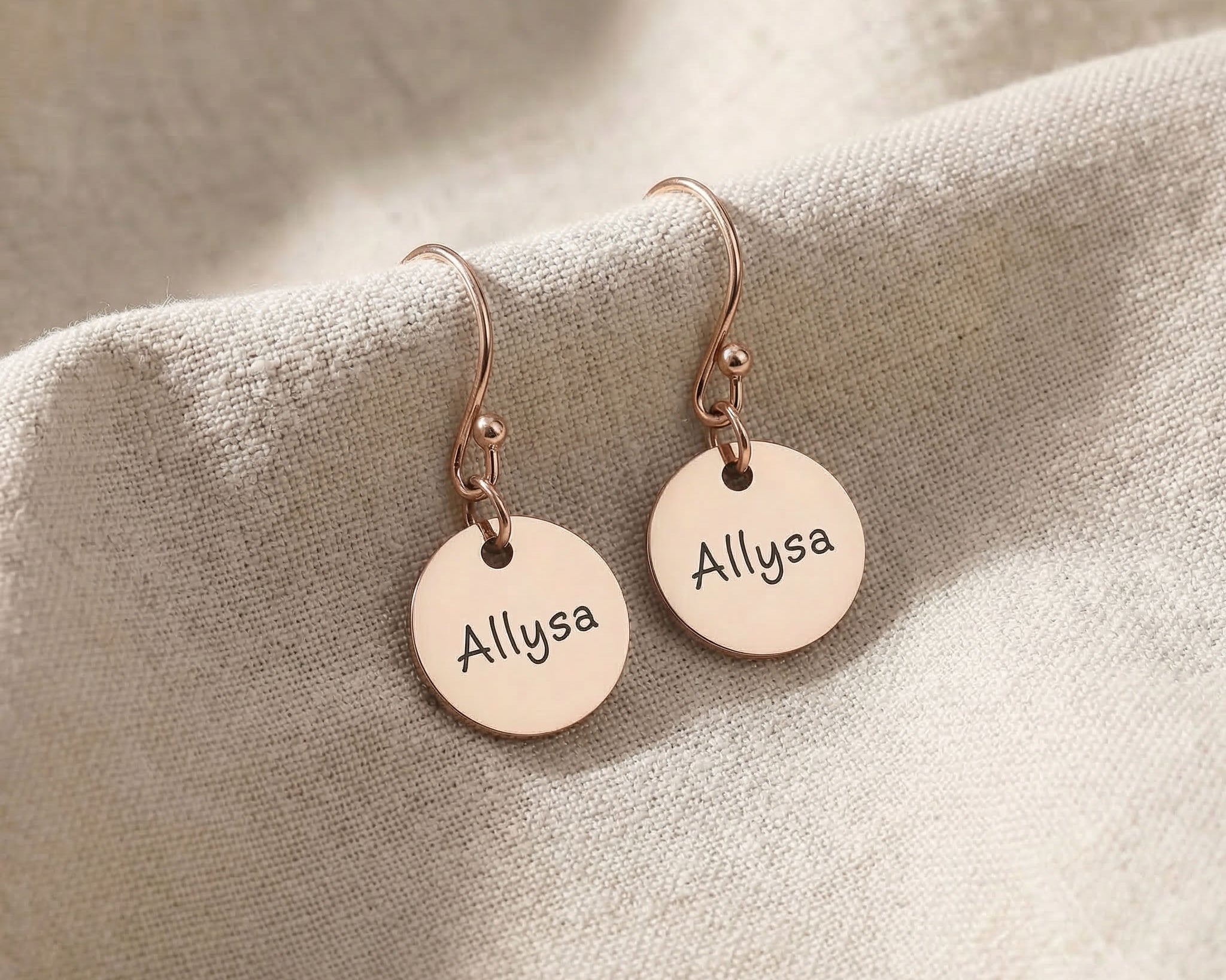 Rose gold personalised earrings with engraved name on disc design