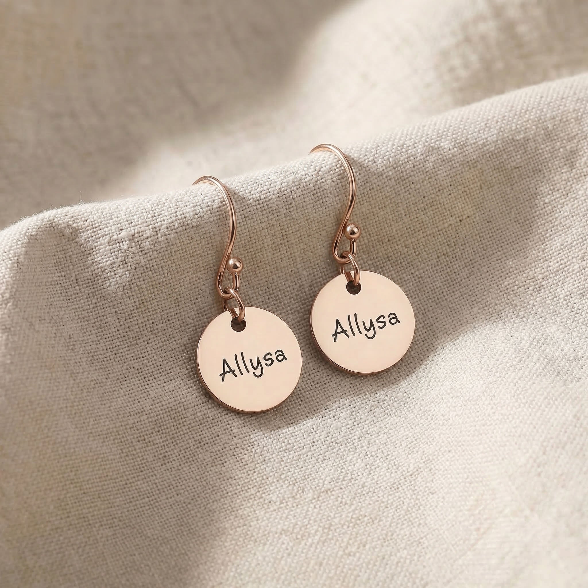 Rose gold personalised earrings with engraved name on disc design