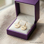 Personalised disc earrings presented in elegant jewelry gift box packaging