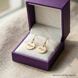 Personalised disc earrings presented in elegant jewelry gift box packaging
