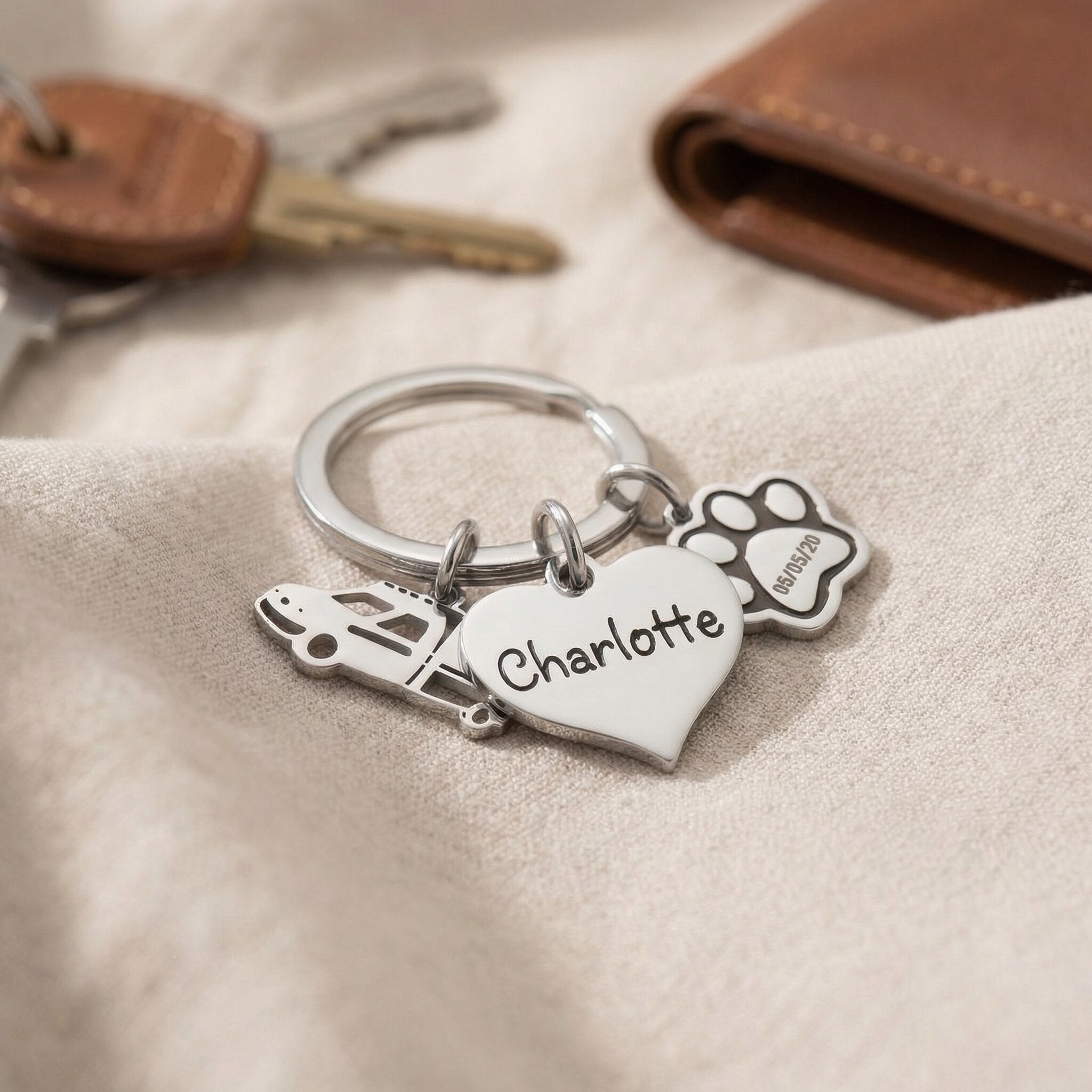 Personalised keyring charms with engraved names and symbol charms, meaningful keepsake set