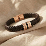 Personalised leather bracelet with rose gold engraved name charms, bold and meaningful design