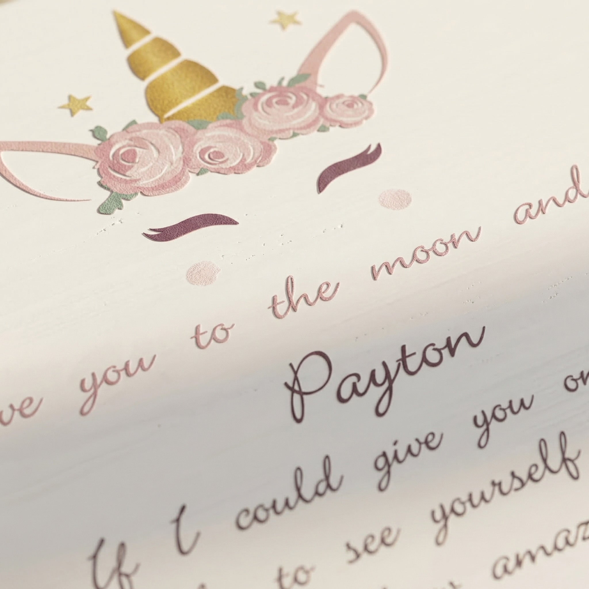 Close-up of personalised musical jewellery box with printed message and decorative design