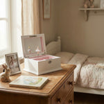 Personalised musical jewellery box displayed on bedside table, sentimental keepsake setting