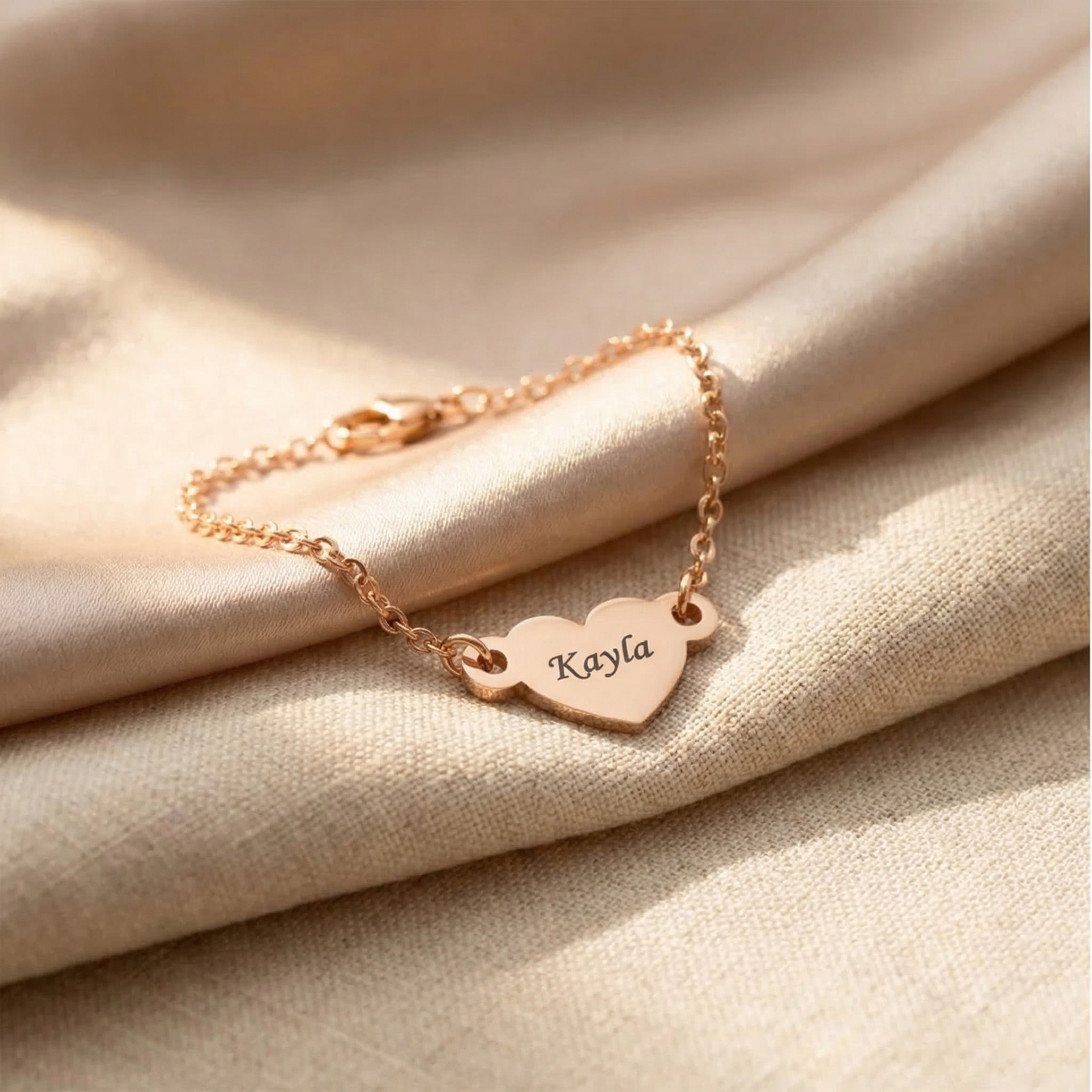 Personalised heart bracelet in rose gold with engraved name, elegant keepsake design
