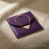 Personalised heart bracelet with engraved name displayed with gift wallet packaging