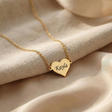 Personalised heart necklace in gold with engraved name detail
