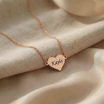 Video showing personalised heart necklace with engraved name and polished finish detail