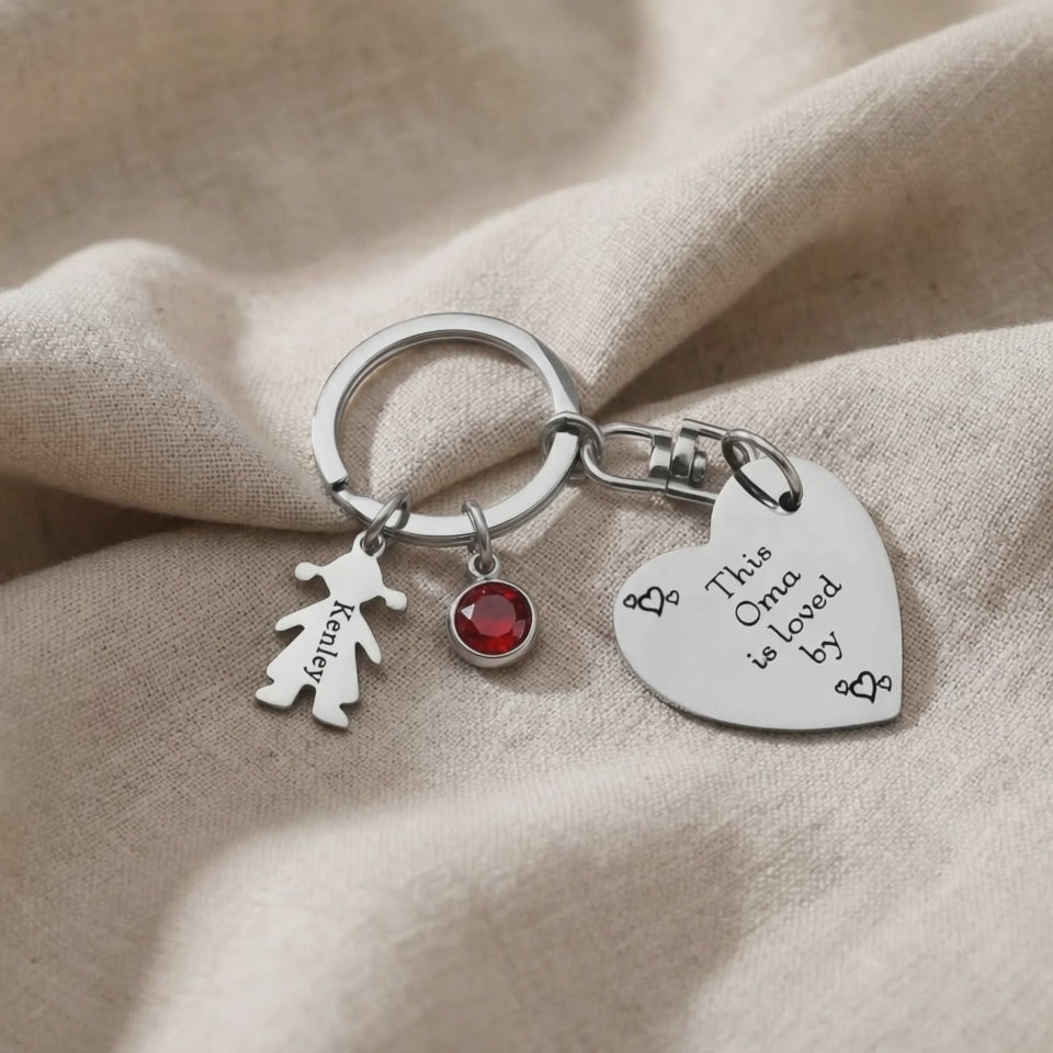 Kids Love Heart Keyring with engraved heart disc and charm shown in close-up product view