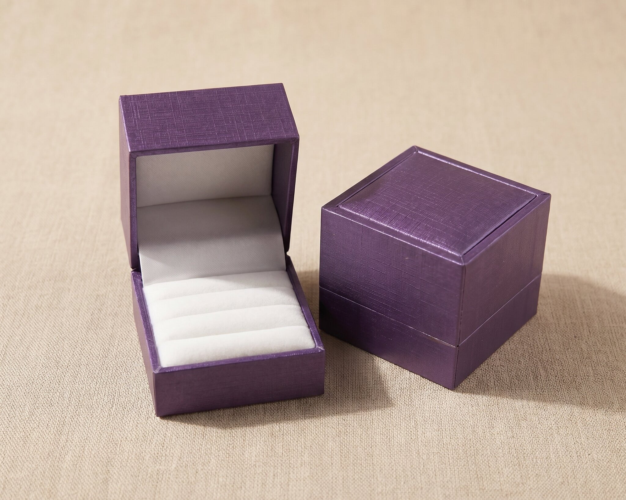 Elegant purple ring gift box with soft velvet finish for luxury jewelry packaging and proposal gifts
