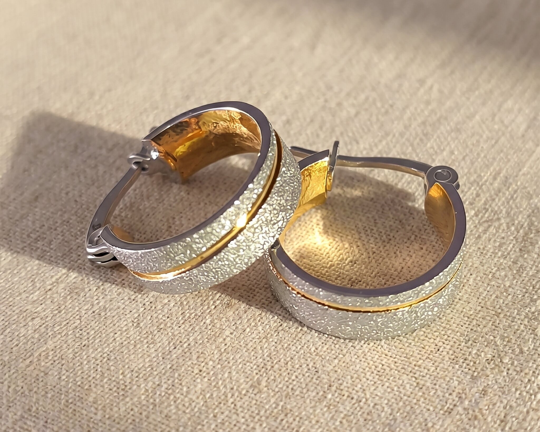 Sparkling two-tone hoop earrings with crystal accents, elegant hoop jewellery for everyday wear