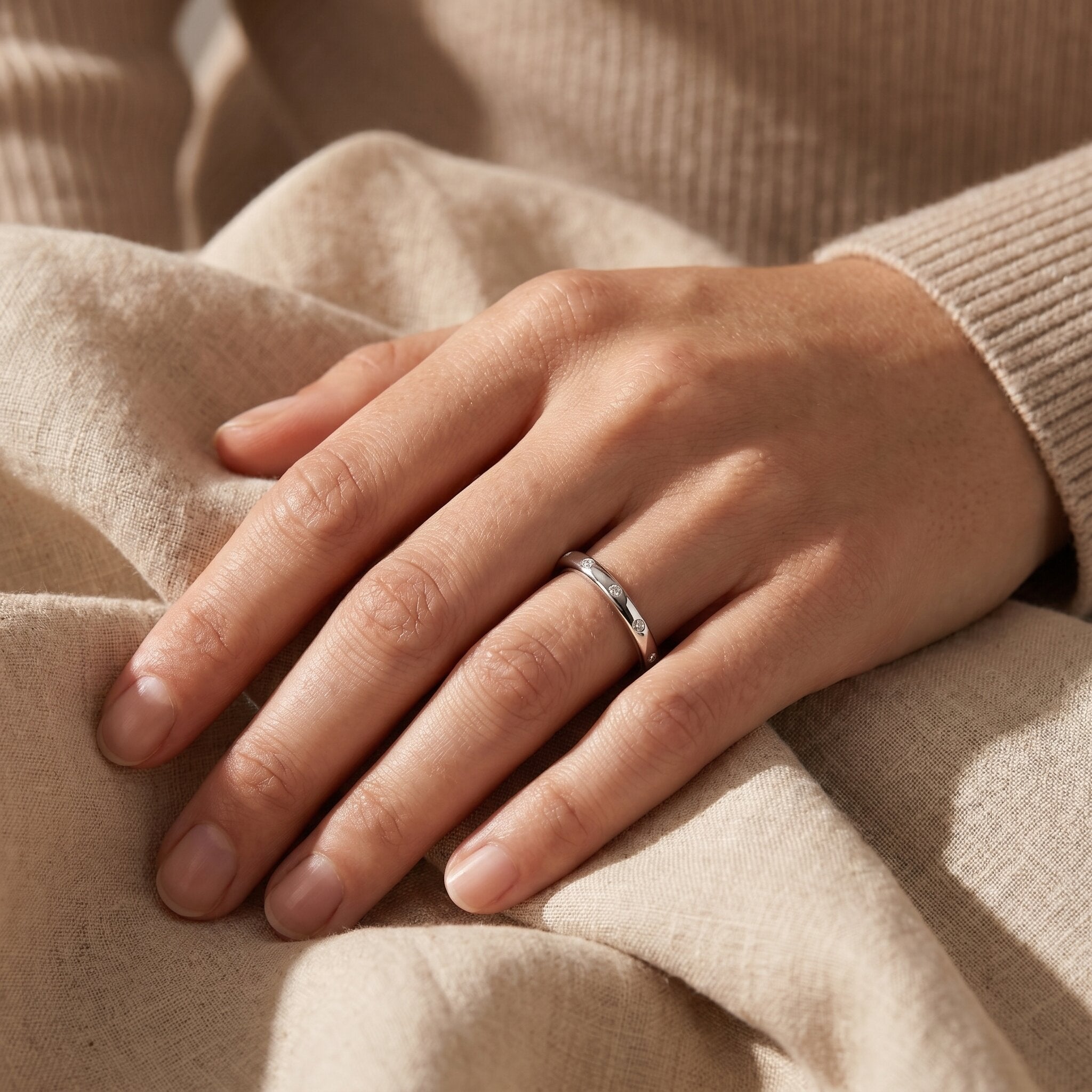 Woman wearing starlets ring, delicate minimalist stacking ring for everyday wear and effortless style