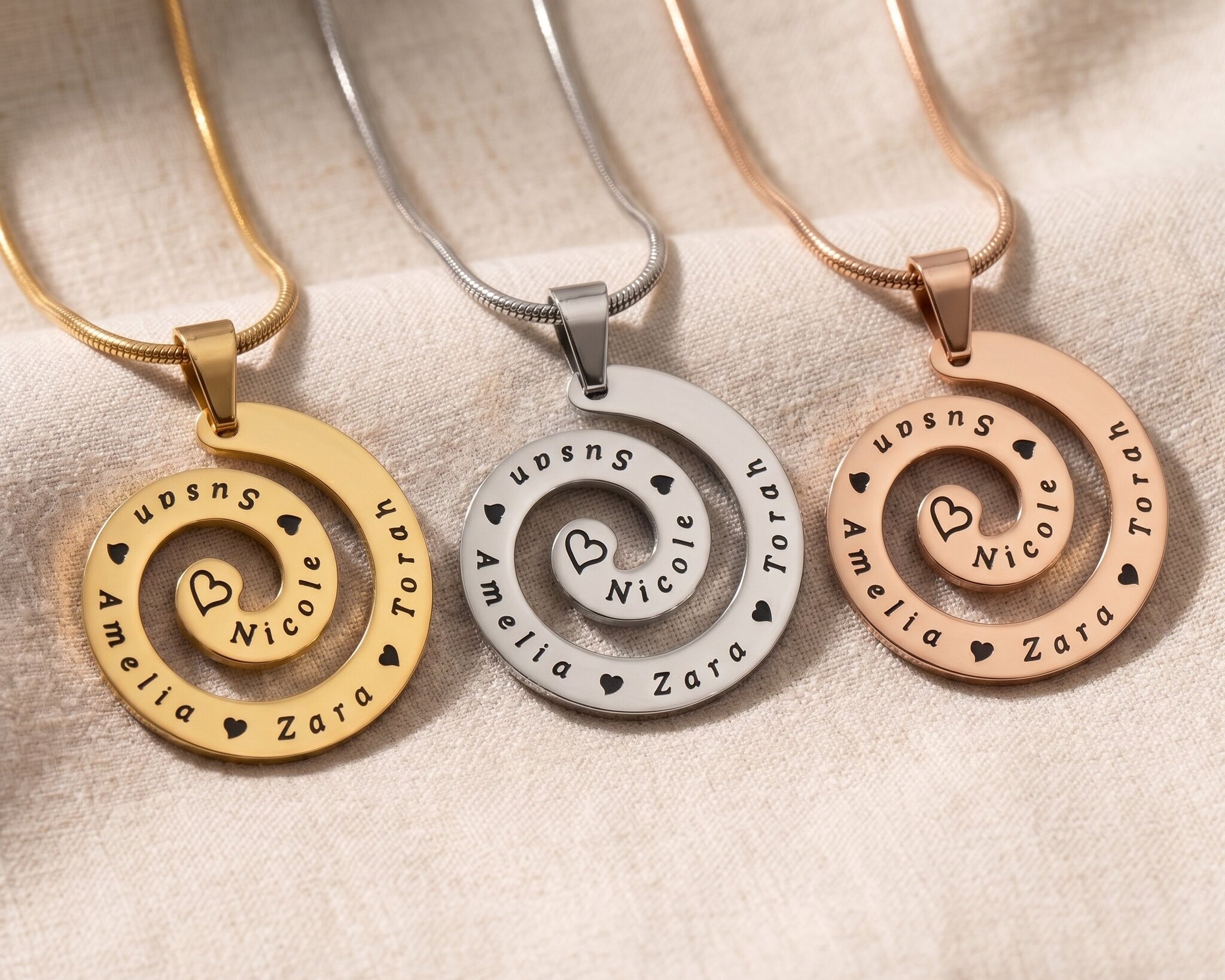 Swirl of time necklace tone comparison showing gold, silver and rose gold keepsake jewellery finishes