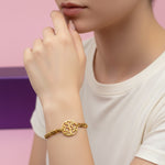 Gold Tree of Life bracelet by Belle Fever styled on wrist, symbol of growth jewelry.