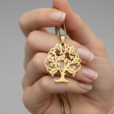 Belle Fever personalised Tree of life necklace held in hand, name pendant, premium family tree jewelry perfect for mothe's day