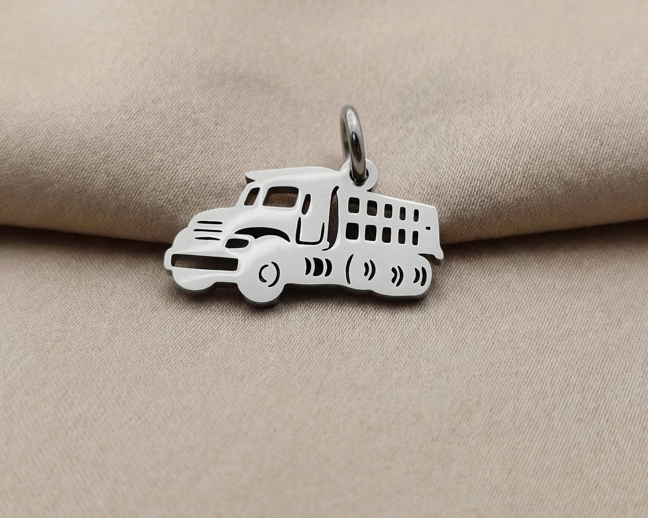 Silver truck charm for keyring symbolizing hard work, travel journeys, and memorable everyday adventures