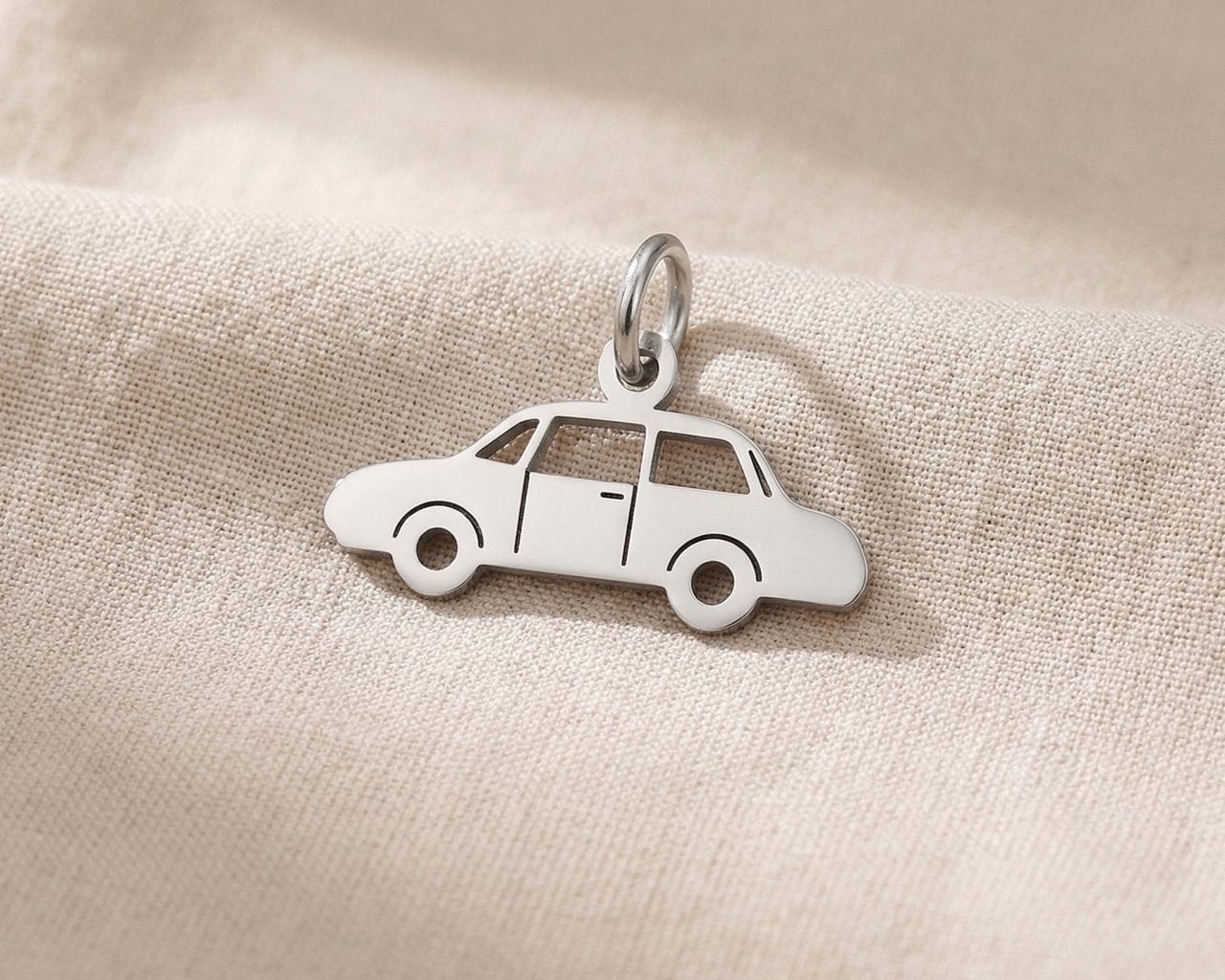Silver vintage car charm for keyring symbolizing classic car passion, nostalgia, and timeless travel memories