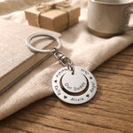 Washer Disc Keyring placed on table with engraved disc, personalised keepsake lifestyle image