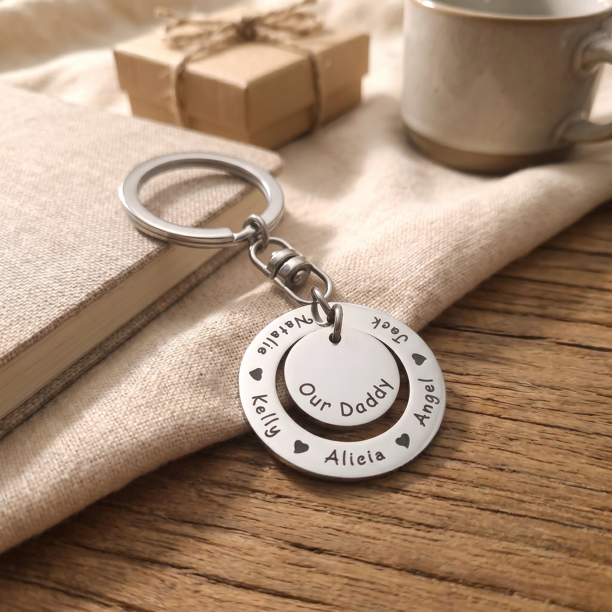 Washer Disc Keyring placed on table with engraved disc, personalised keepsake lifestyle image