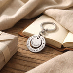 Washer Disc Keyring placed on table with engraved disc, perfect keepsake gift for father or teacher