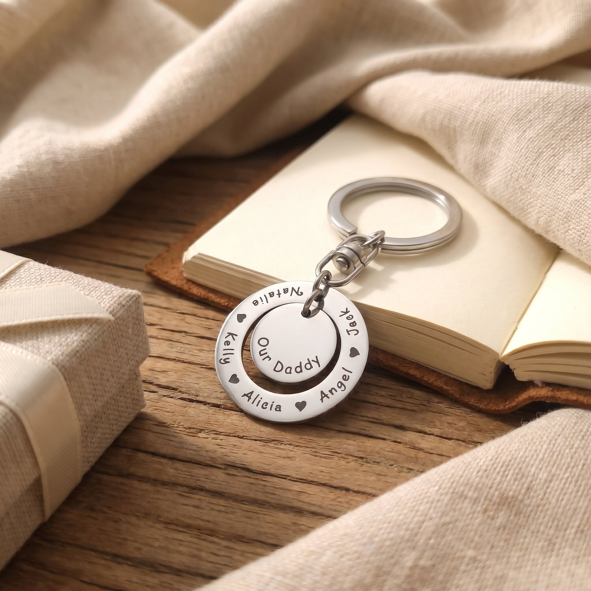 Washer Disc Keyring placed on table with engraved disc, perfect keepsake gift for father or teacher