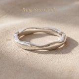 Wave band ring size guide showing curved band width and sculptural design proportions
