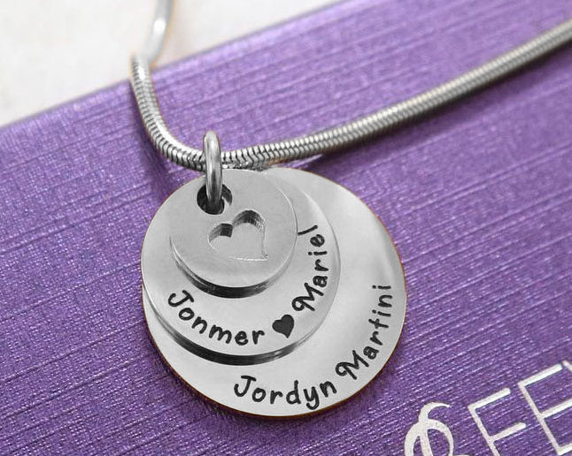 Close-up of silver Tower of Love necklace with layered round charms, design by Belle Fever Jewellery