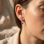 Woman wearing zircon hoop earrings, elegant crystal hoop jewellery for everyday style and gifting